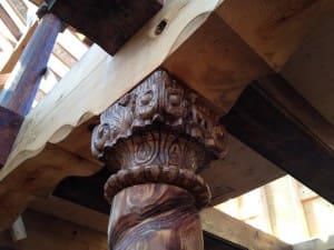 Intricate work is displayed on a log beam