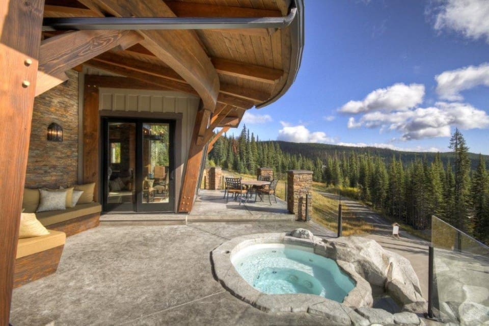 hot tub on patio over looking forest