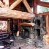 traditional log home with oversized fireplace