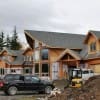 large luxury timber frame home under construction