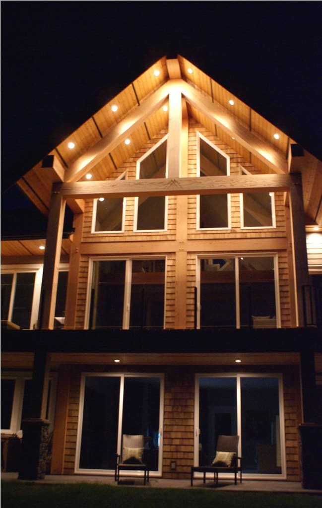 West Coast style home lite up at night
