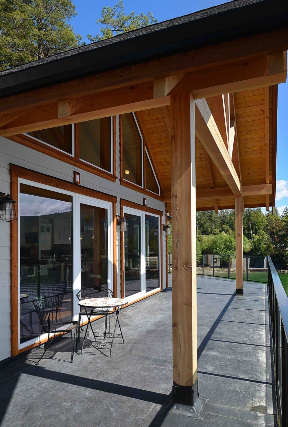 The deck and exposed beams outside a timber frame home