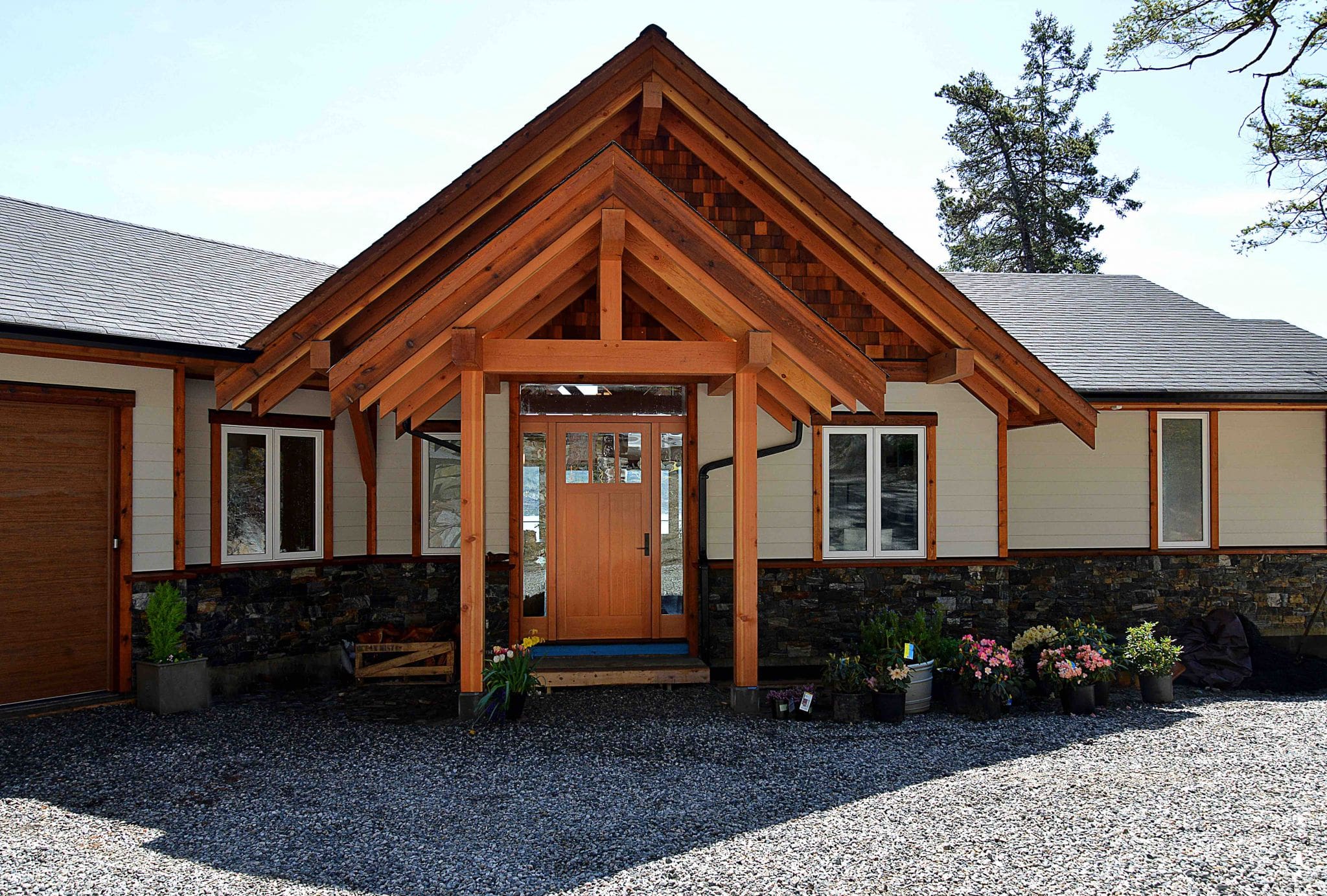 The entranceway of a modern timber frame home