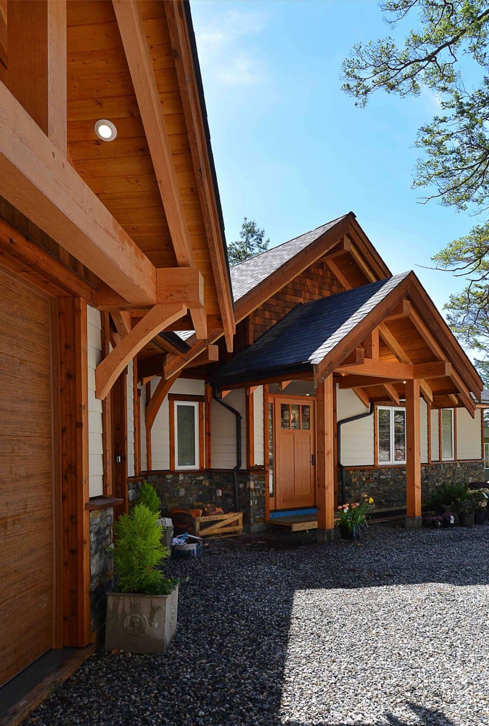 A sideview of the outside of a timber frame home