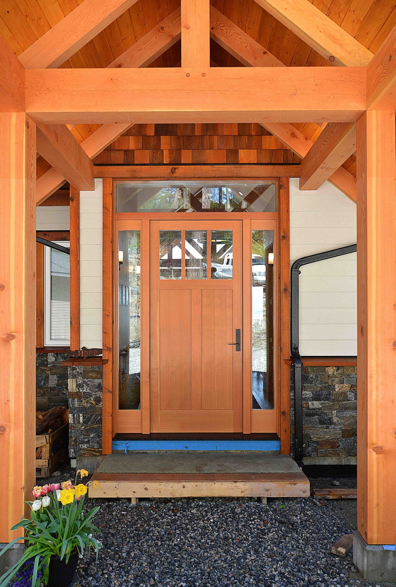 The wood door of a timber frame home