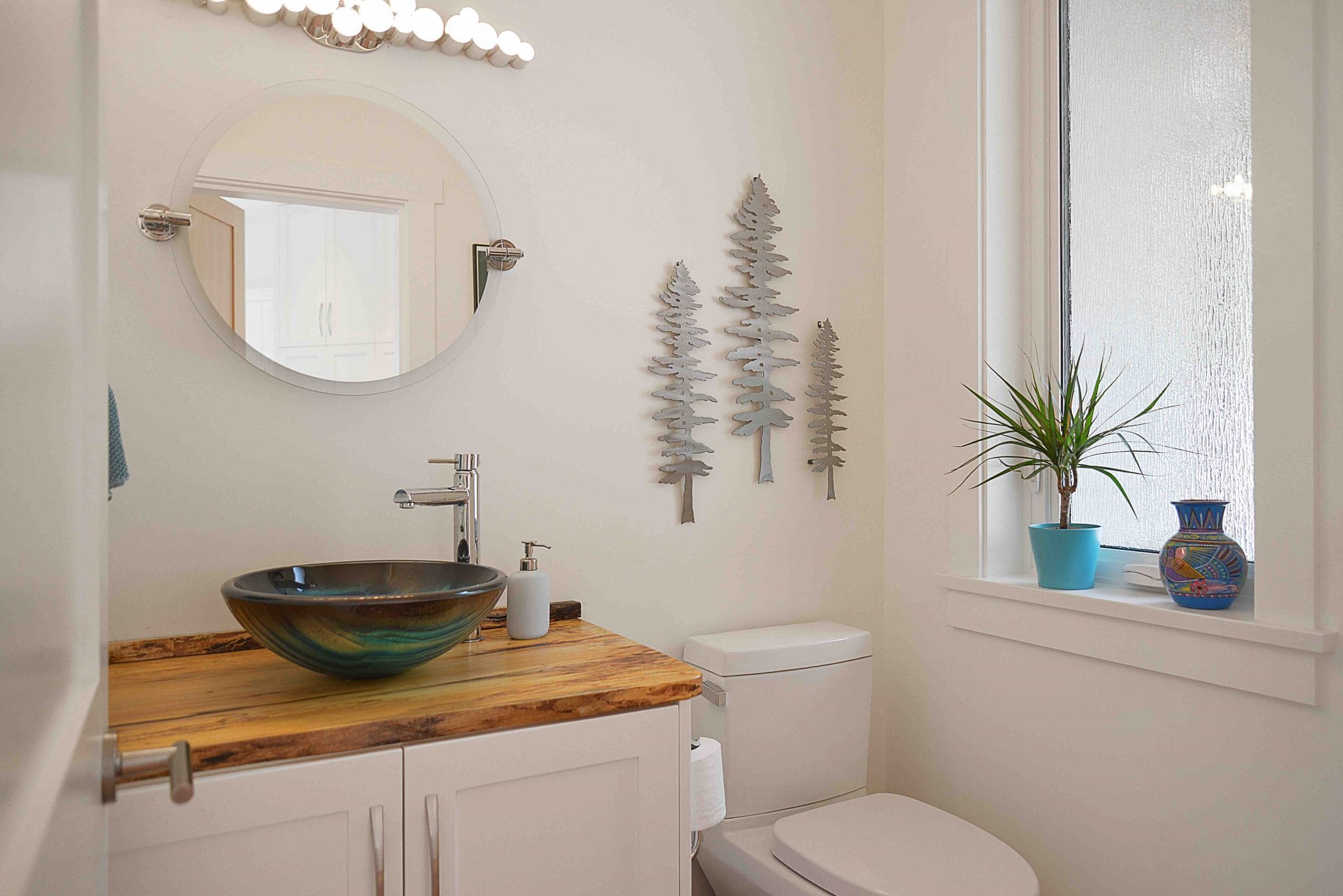 Bathroom with modern sink and wall decorations