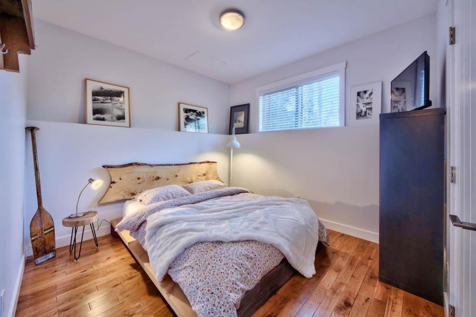 Third bedroom with wood floor in modern home