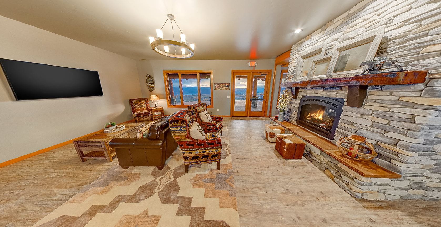 Secondary living room with rock fireplace