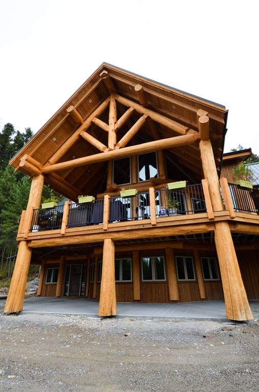 Two story covered deck on a post and beam log home