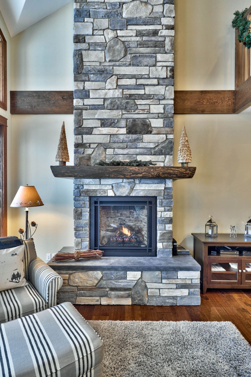 Close-up of the stone fireplace in a timber frame log home