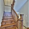 Staircase heading upstairs in a timber frame log home