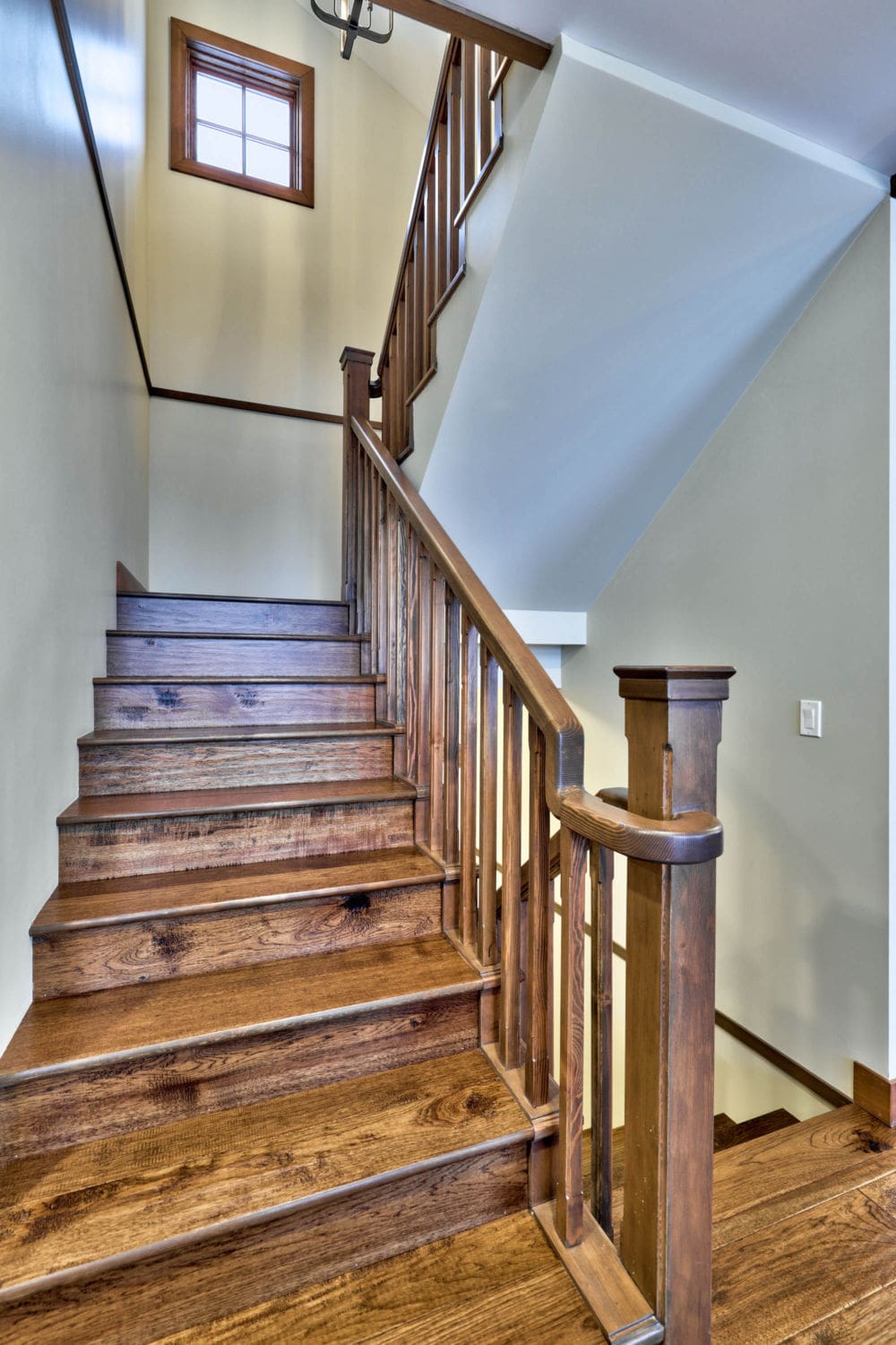 Staircase heading upstairs in a timber frame log home