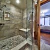 Glass shower in a timber frame log home