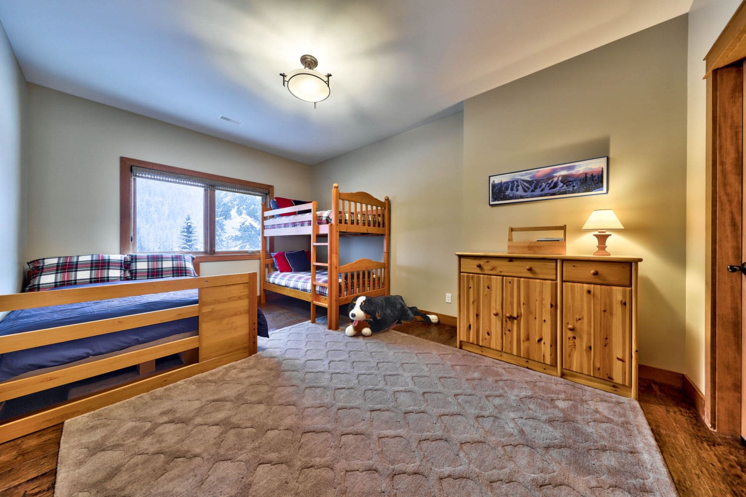Rec room with bunk beds in timber frame log home