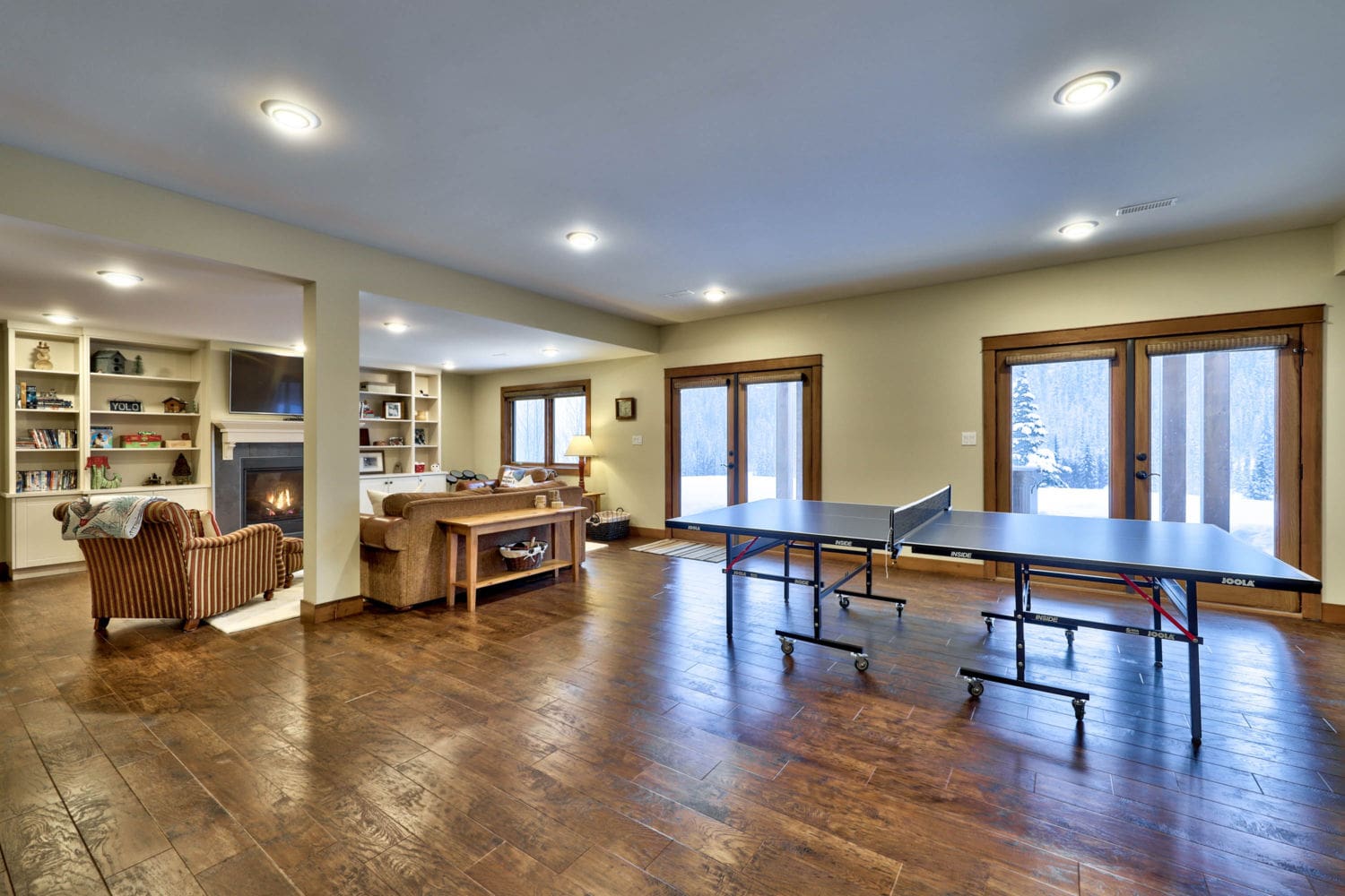Rec-room with ping pong table in timber frame log home